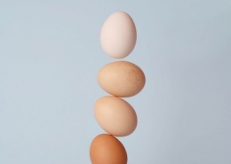 five eggs balanced on top of each other